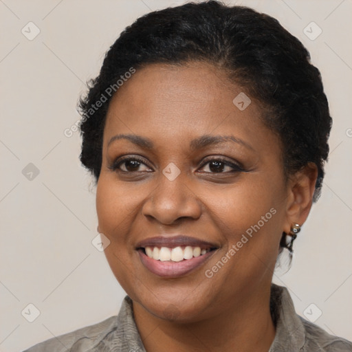 Joyful black young-adult female with short  brown hair and brown eyes