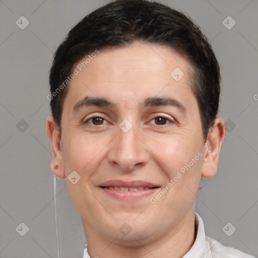 Joyful white adult male with short  brown hair and brown eyes