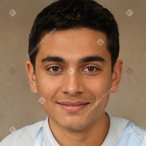 Joyful latino young-adult male with short  brown hair and brown eyes