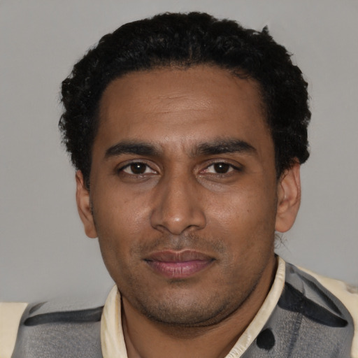 Neutral black young-adult male with short  black hair and brown eyes