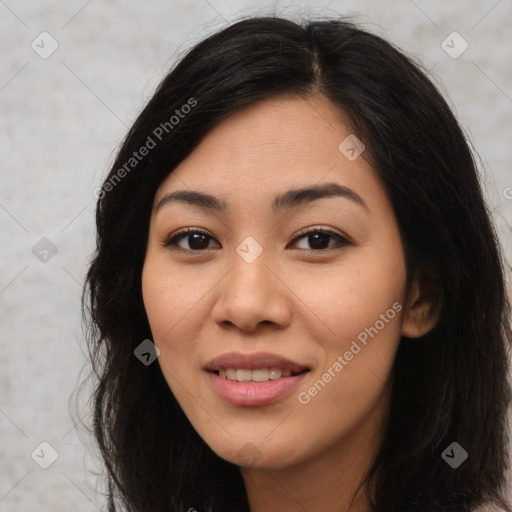 Joyful latino young-adult female with long  brown hair and brown eyes