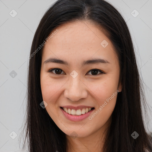 Joyful asian young-adult female with long  brown hair and brown eyes