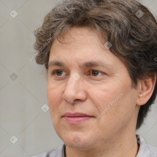 Joyful white adult male with medium  brown hair and brown eyes