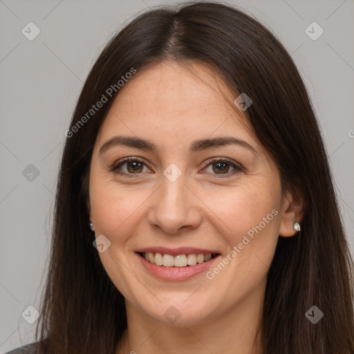 Joyful white young-adult female with long  brown hair and brown eyes