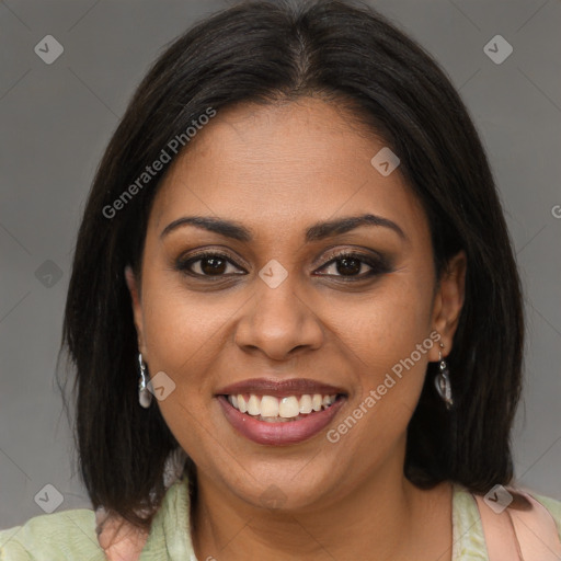 Joyful black young-adult female with medium  brown hair and brown eyes