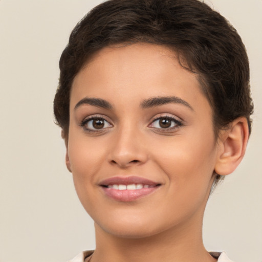 Joyful white young-adult female with short  brown hair and brown eyes