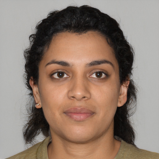 Joyful latino young-adult female with medium  black hair and brown eyes