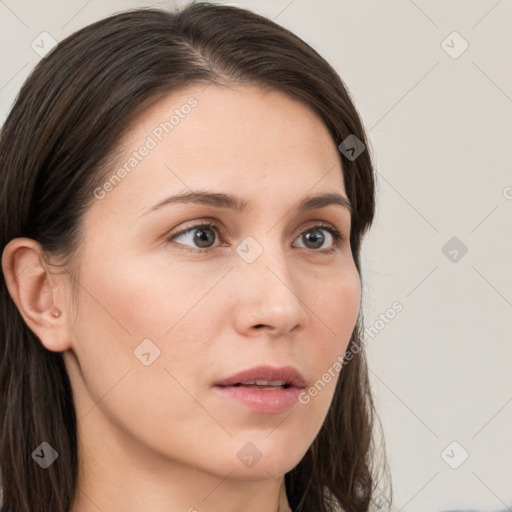 Neutral white young-adult female with long  brown hair and brown eyes