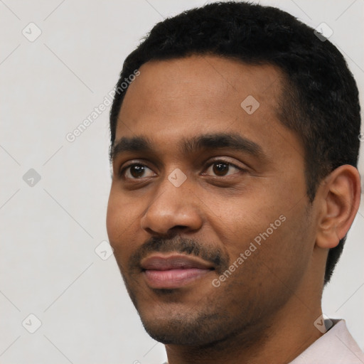 Neutral black young-adult male with short  black hair and brown eyes
