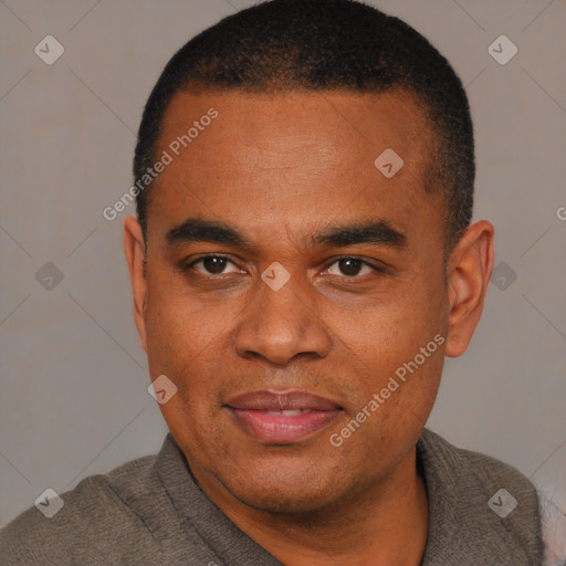 Joyful black young-adult male with short  brown hair and brown eyes