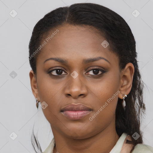 Joyful black young-adult female with long  brown hair and brown eyes