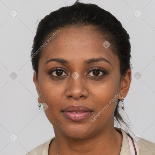 Joyful black adult female with short  black hair and brown eyes