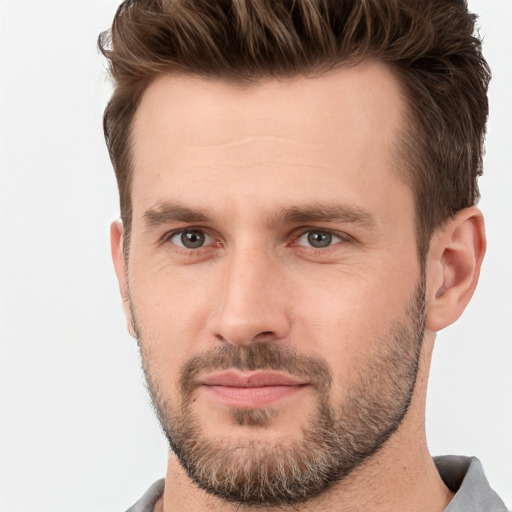 Joyful white young-adult male with short  brown hair and brown eyes