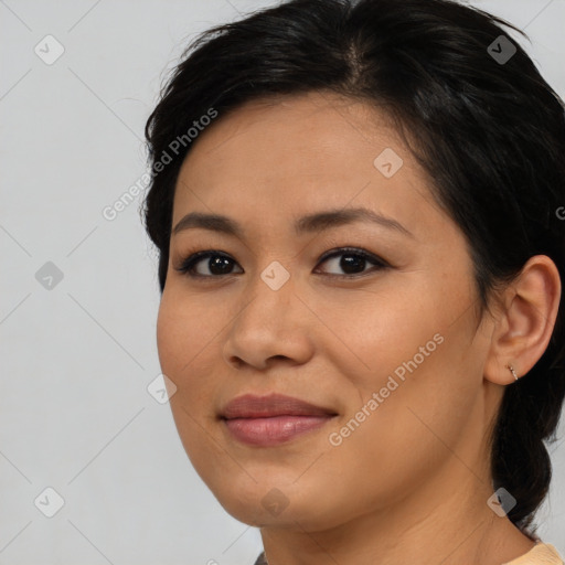 Joyful asian young-adult female with medium  brown hair and brown eyes