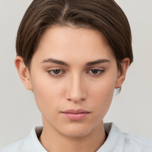 Neutral white young-adult female with short  brown hair and brown eyes