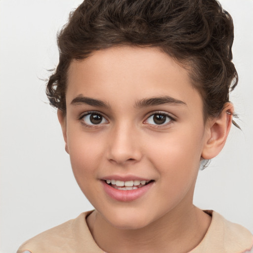 Joyful white child female with short  brown hair and brown eyes