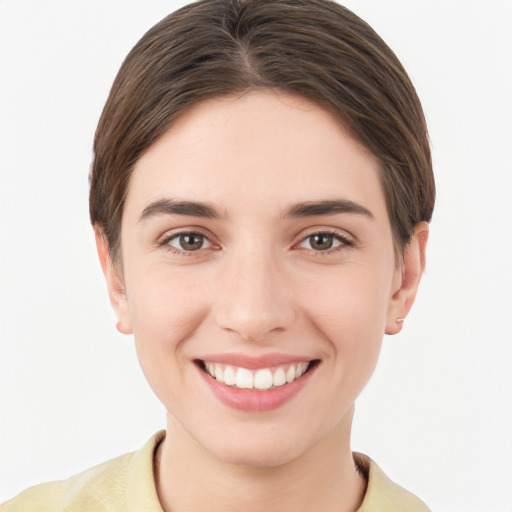 Joyful white young-adult female with short  brown hair and brown eyes