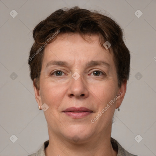 Joyful white adult female with short  brown hair and grey eyes