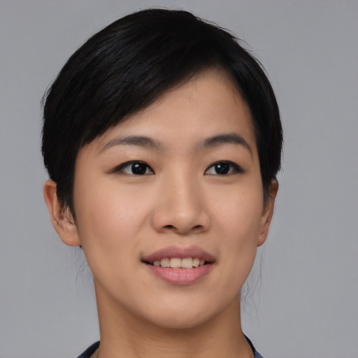 Joyful asian young-adult female with short  black hair and brown eyes