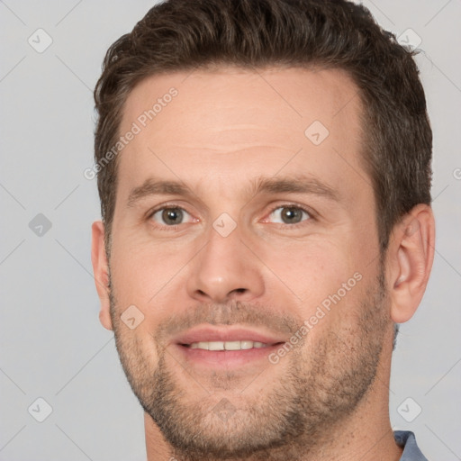 Joyful white adult male with short  brown hair and brown eyes