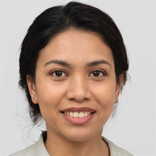 Joyful white young-adult female with medium  brown hair and brown eyes
