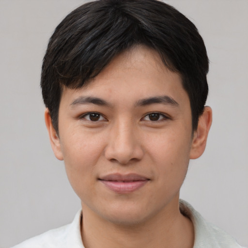 Joyful asian young-adult female with short  black hair and brown eyes