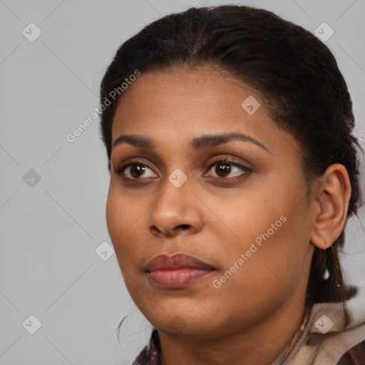 Neutral black young-adult female with medium  brown hair and brown eyes