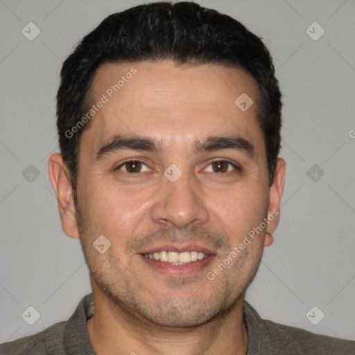 Joyful white young-adult male with short  black hair and brown eyes