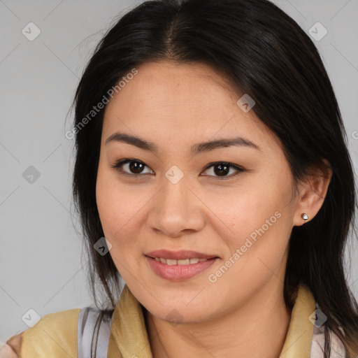 Joyful latino young-adult female with medium  brown hair and brown eyes