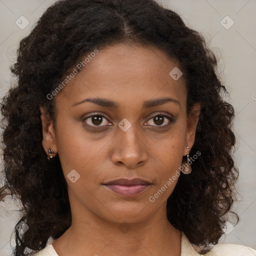 Neutral black young-adult female with medium  brown hair and brown eyes