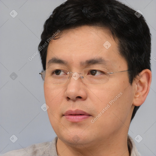 Neutral asian adult male with short  brown hair and brown eyes