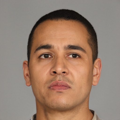 Neutral latino adult male with short  brown hair and brown eyes