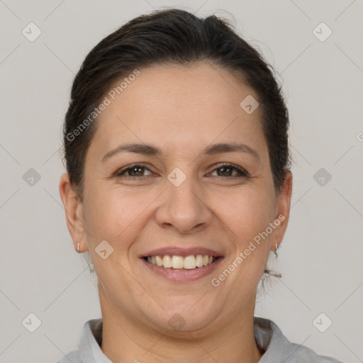 Joyful white adult female with short  brown hair and brown eyes