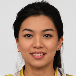 Joyful asian young-adult female with medium  brown hair and brown eyes