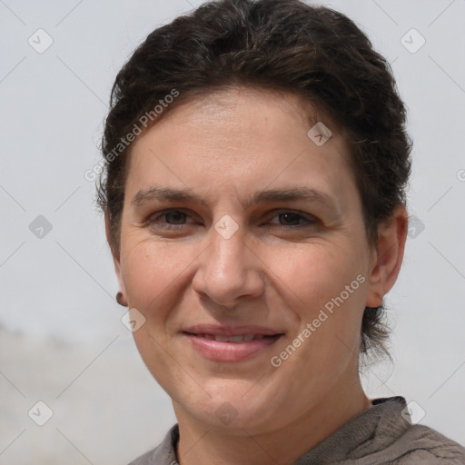 Joyful white adult female with short  brown hair and brown eyes