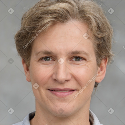 Joyful white adult male with short  brown hair and grey eyes