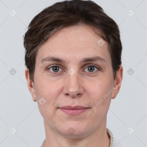 Joyful white young-adult female with short  brown hair and grey eyes