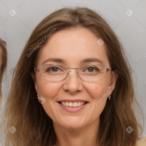 Joyful white adult female with long  brown hair and brown eyes