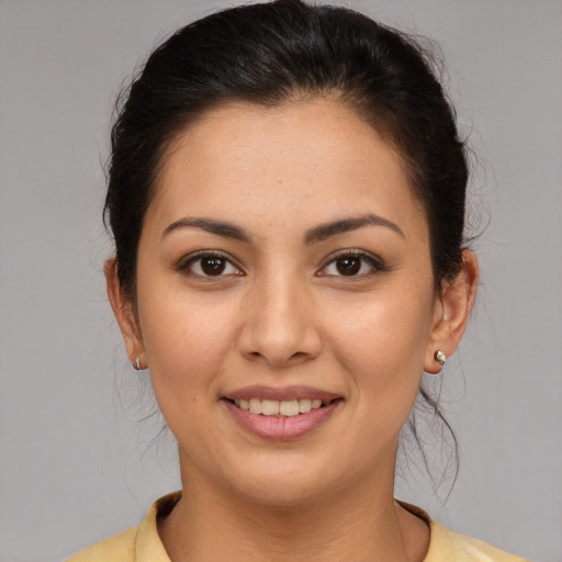 Joyful white young-adult female with medium  brown hair and brown eyes