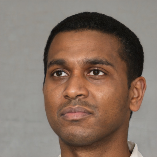 Neutral black young-adult male with short  black hair and brown eyes