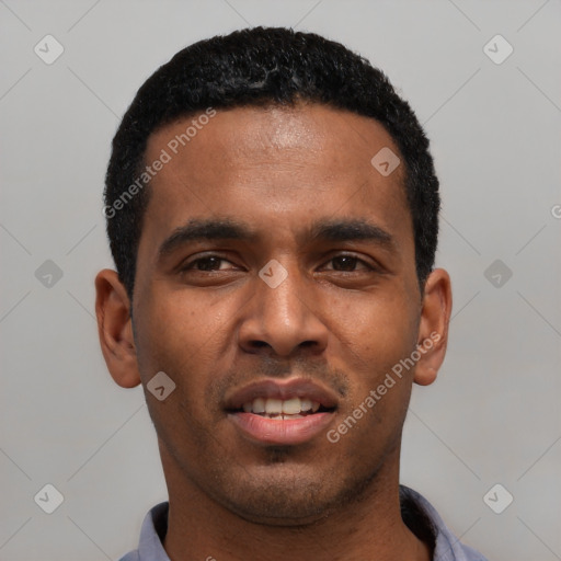 Joyful latino young-adult male with short  black hair and brown eyes
