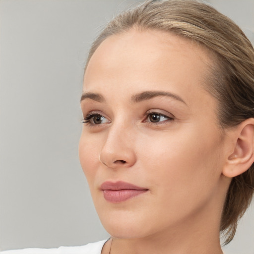 Neutral white young-adult female with medium  brown hair and brown eyes