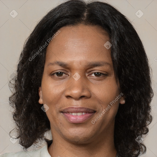 Joyful black young-adult female with medium  brown hair and brown eyes