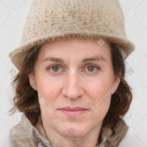 Joyful white adult female with medium  brown hair and grey eyes