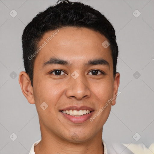 Joyful latino young-adult male with short  black hair and brown eyes