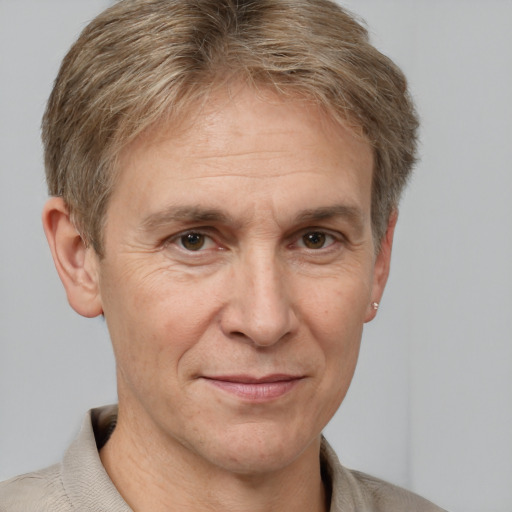 Joyful white adult male with short  brown hair and grey eyes