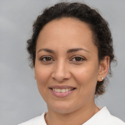 Joyful white adult female with short  brown hair and brown eyes