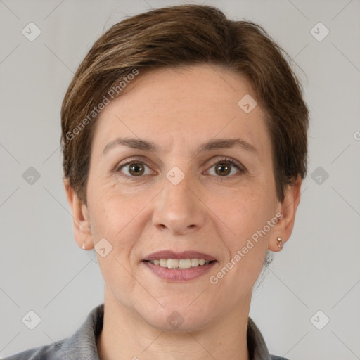 Joyful white adult female with short  brown hair and grey eyes