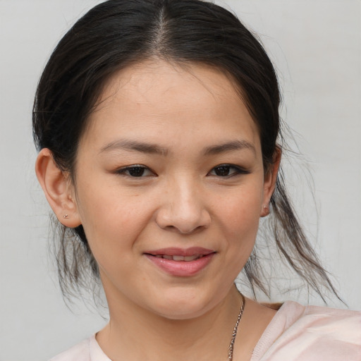 Joyful white young-adult female with medium  brown hair and brown eyes