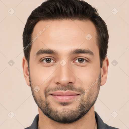 Joyful white young-adult male with short  black hair and brown eyes